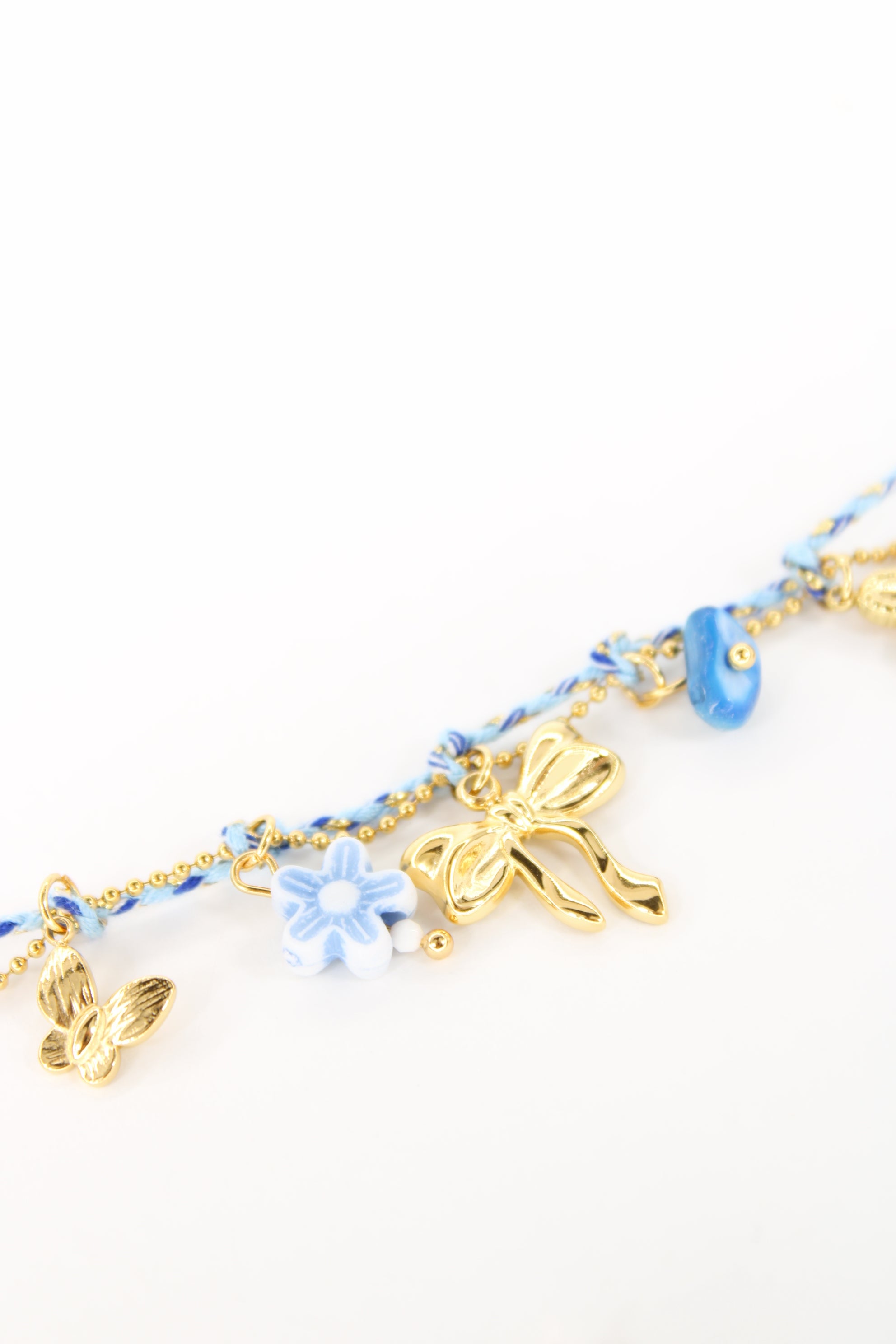 Bracelet Margaret cordon et charms papillon, fleur et nœud en acier inoxydable – Rose ou bleu – Bijou femme Langon